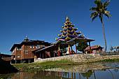 Inle Lake Myanmar. All the buildings are constructed on piles. Residents travel around by canoe, but there are also bamboo walkways and bridges over the canals, monasteries and stupas. 